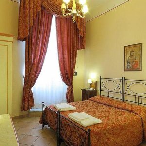 Casa di Barbano guest room with traditional Tuscan décor near Santa Maria Novella in Florence.